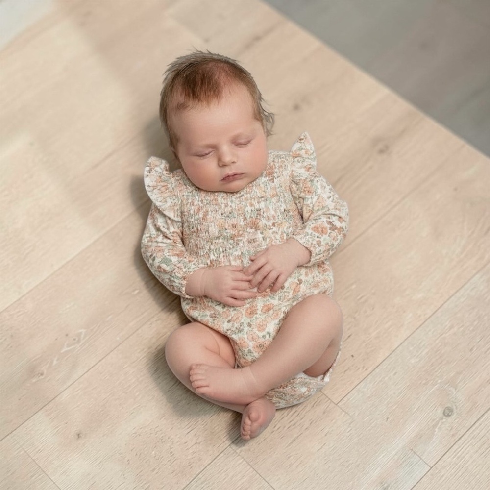 Smocked Floral Long-Sleeve Baby Bodysuit in Peach Floral